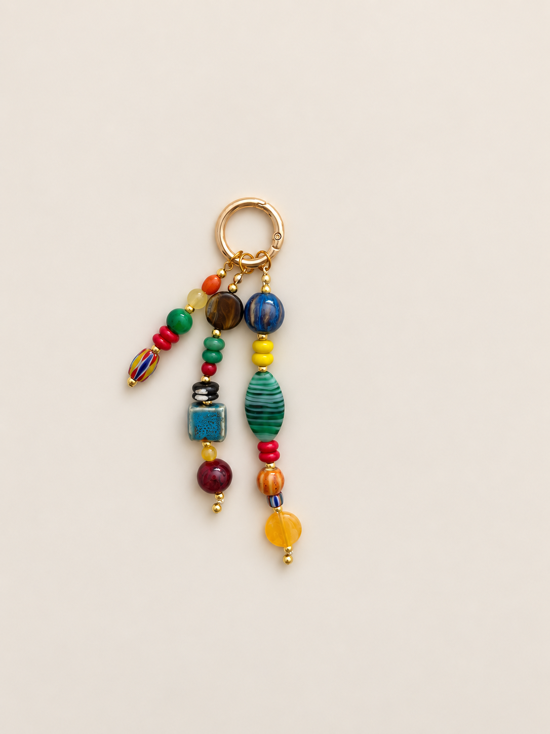 Colorful Ceramic beaded keychain with mixed red, blue, green and yellow beads, varied shapes and gold-tone ring